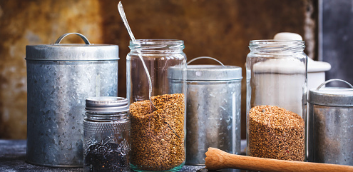 seeds in jars and storage bins for garden